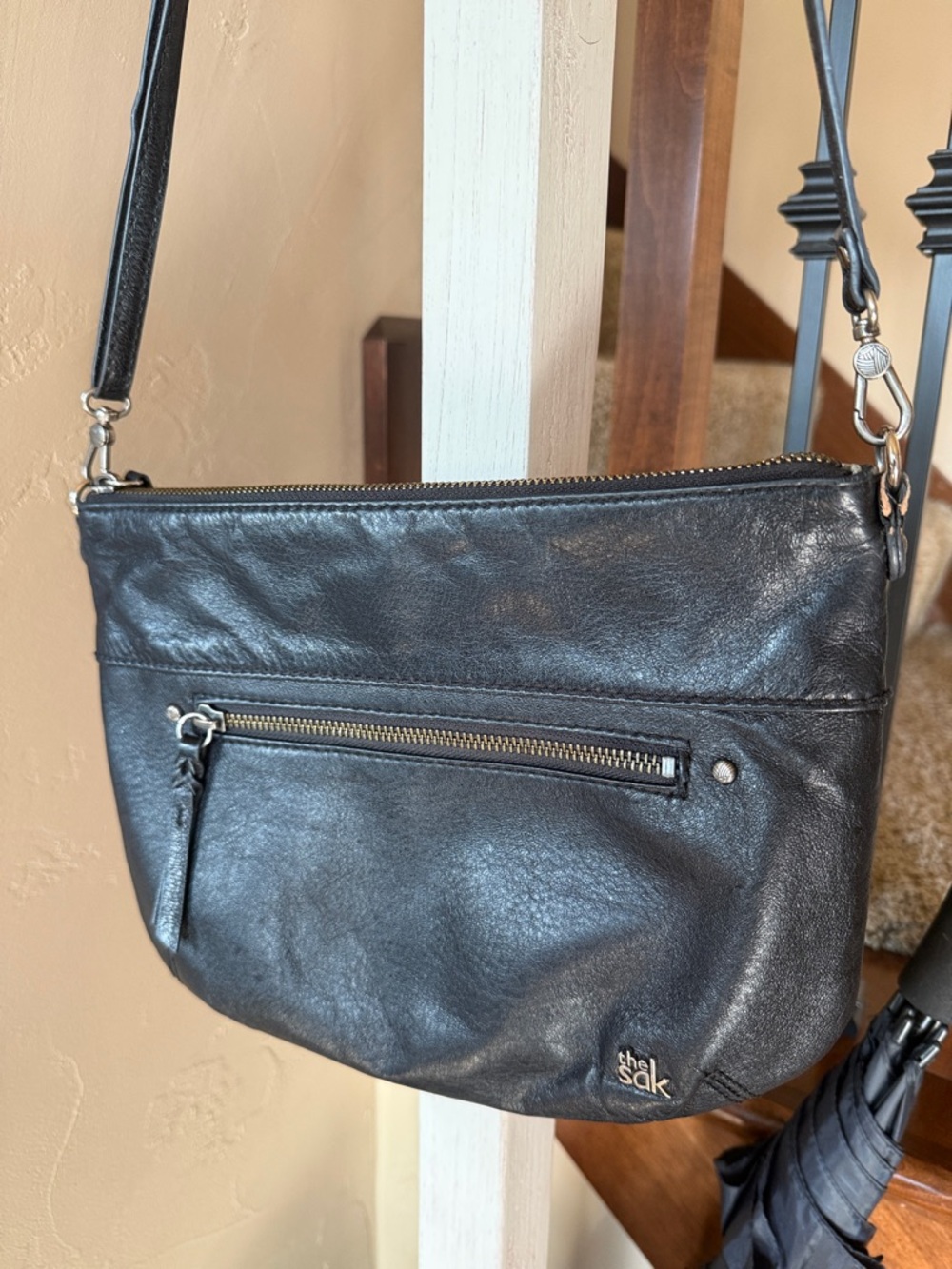 The Sak Black Leather Crossbody with Front Zip Pocket and Silver Hardware